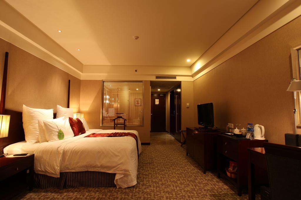 Ruiwan New Century Hotel Tianjin Rum bild